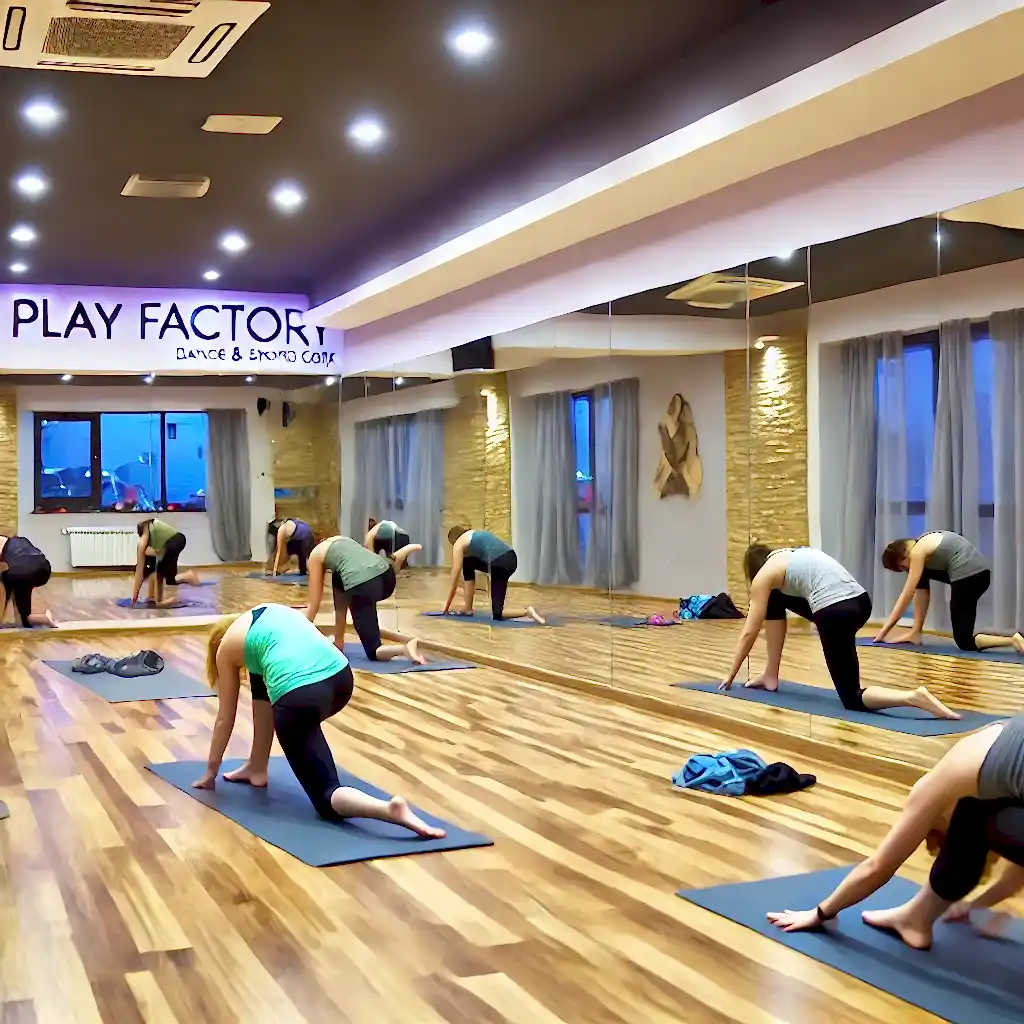 DALL·E 2024 11 13 12.29.50 A peaceful dance studio at Play Factory Dance and Sports Complex featuring a yoga class. Participants are practicing various yoga poses on mats focus